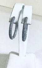 Diamond closure Sterling Silver CZ hoop earrings.